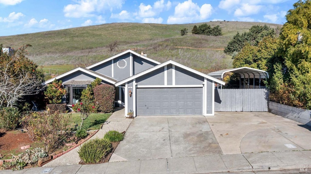 single story home featuring a carport