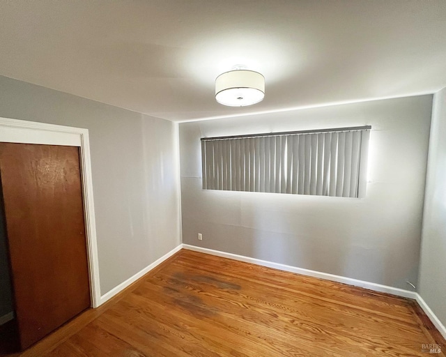 empty room featuring hardwood / wood-style flooring