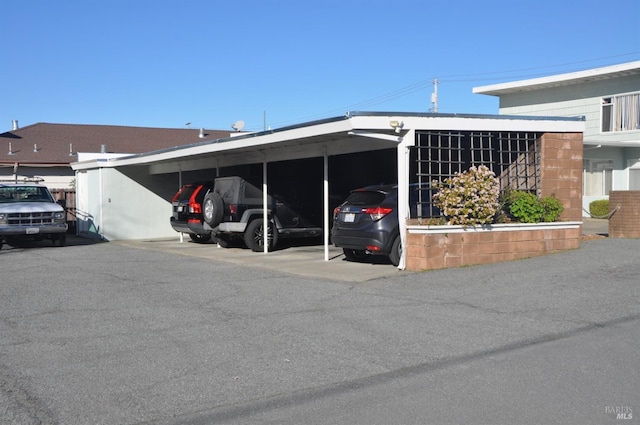 view of property exterior featuring a carport