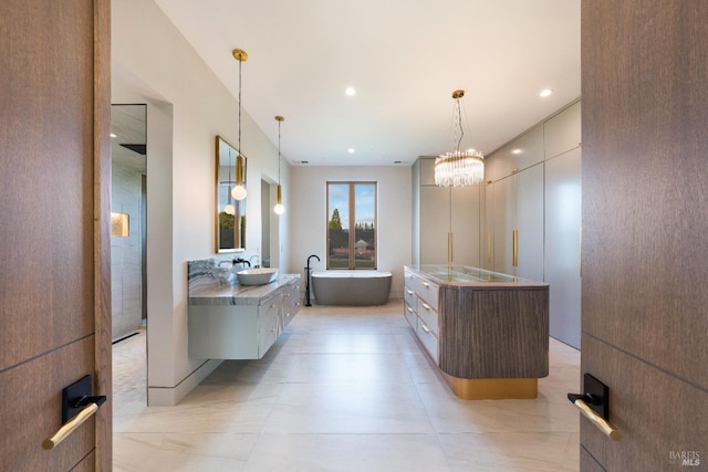 bathroom with vanity and a bathing tub