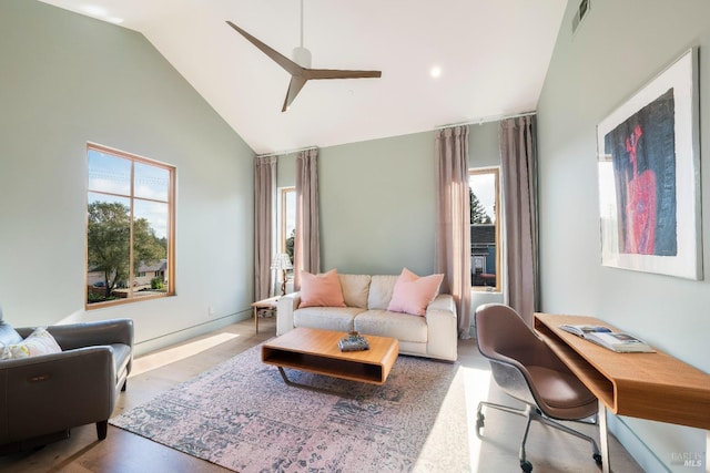 living room with high vaulted ceiling and ceiling fan