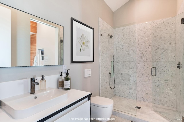 bathroom with vanity, toilet, a shower with door, and lofted ceiling