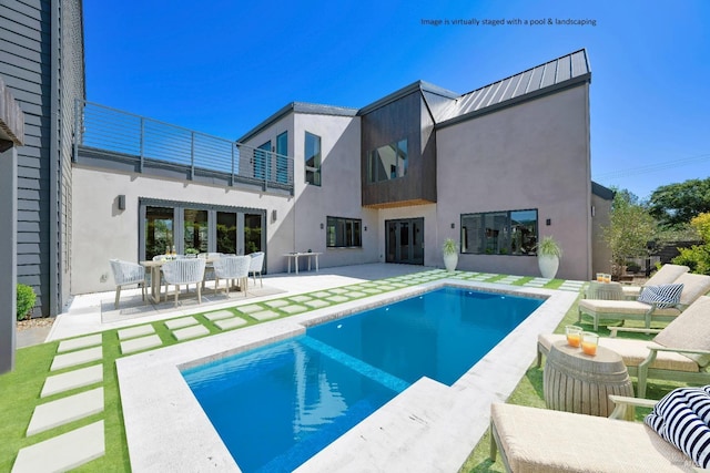 view of swimming pool featuring a patio