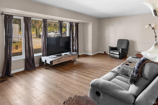 living room with light hardwood / wood-style flooring