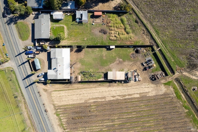 birds eye view of property featuring a rural view