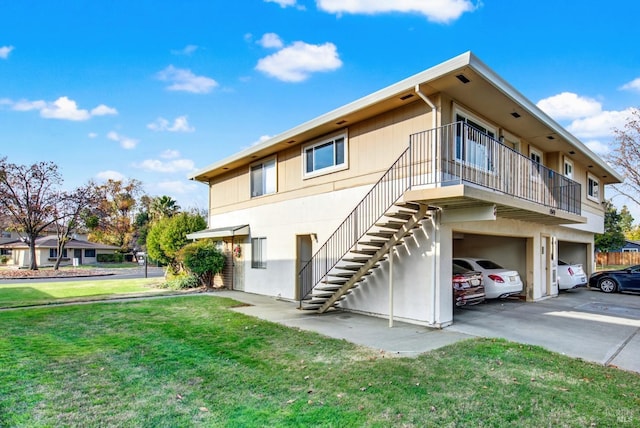 exterior space featuring a garage and a yard