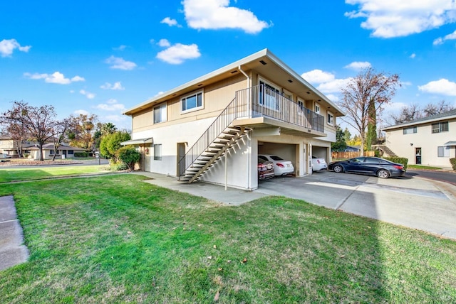 exterior space with a yard and a garage