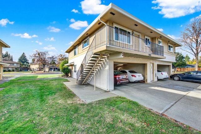 view of home's exterior with a yard and a garage