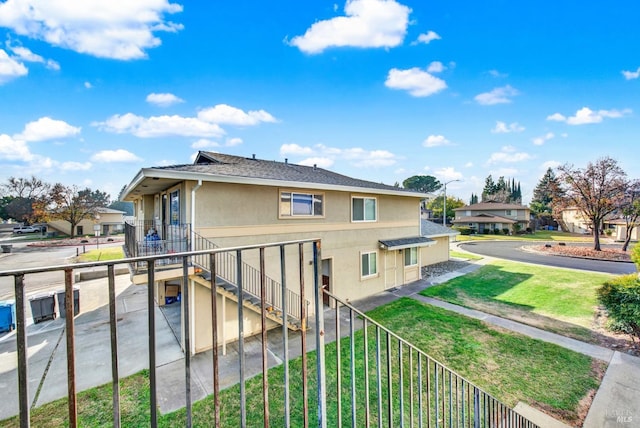 view of property exterior featuring a lawn