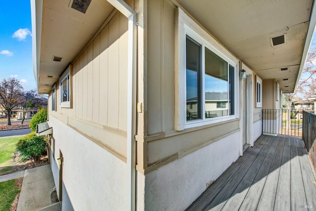 view of side of property featuring a balcony