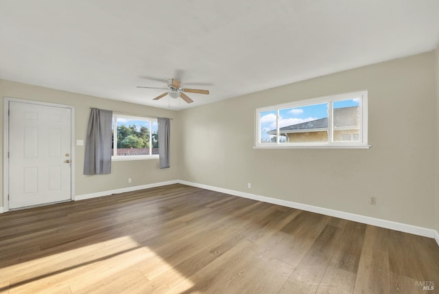 spare room with ceiling fan and hardwood / wood-style floors