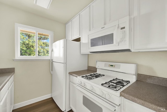 kitchen featuring white cabinetry, white appliances, and dark hardwood / wood-style floors