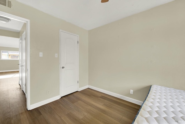 unfurnished bedroom with hardwood / wood-style flooring and ceiling fan