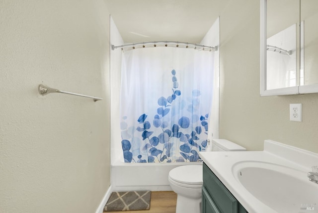 full bathroom featuring shower / tub combo, vanity, wood-type flooring, and toilet