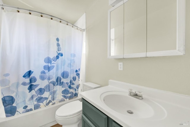 full bathroom with vanity, shower / bath combo, and toilet