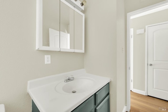 bathroom featuring vanity and hardwood / wood-style floors