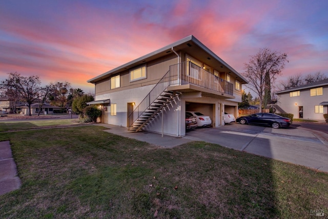 exterior space with a garage and a yard