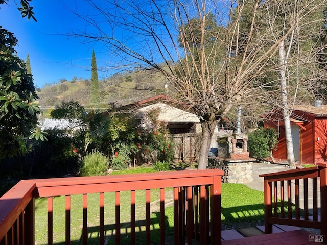 wooden deck featuring a yard