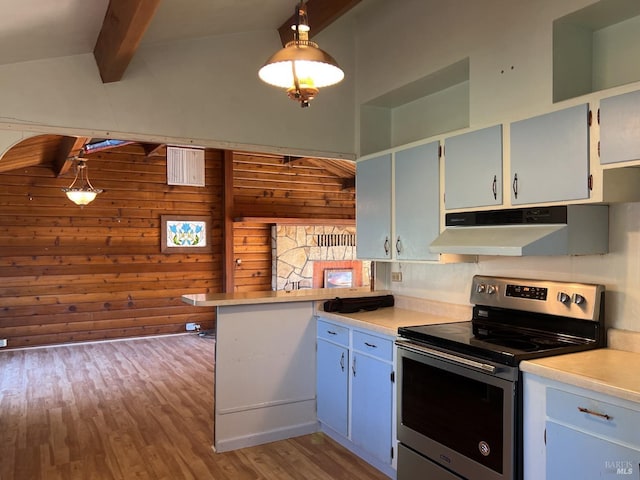 kitchen with light hardwood / wood-style flooring, pendant lighting, beam ceiling, electric range, and wooden walls