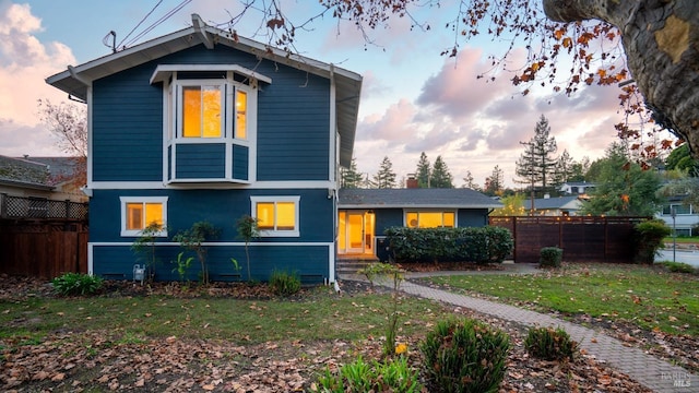 view of front of property with a yard