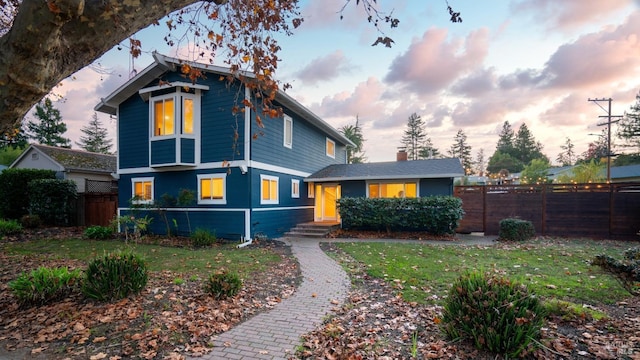 view of front of property with a lawn