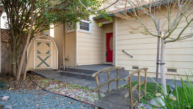 view of shed featuring fence