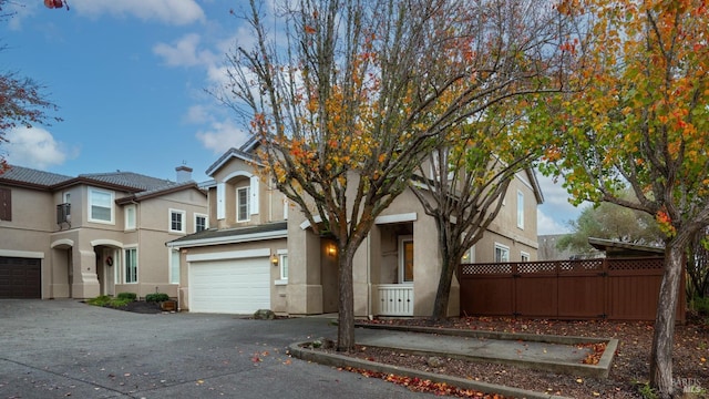 front facade with a garage