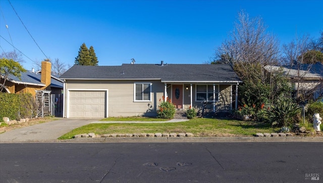 single story home with a garage and a front yard