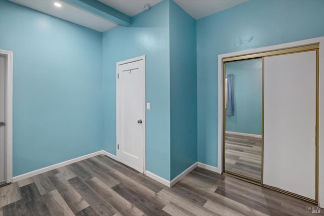 interior space featuring hardwood / wood-style floors and a closet