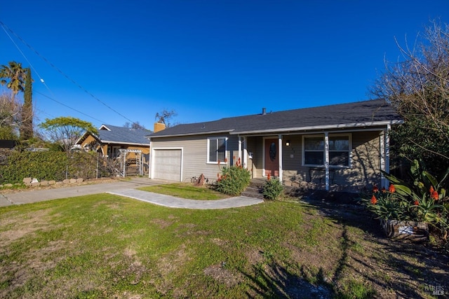 view of front of home with a garage and a front lawn