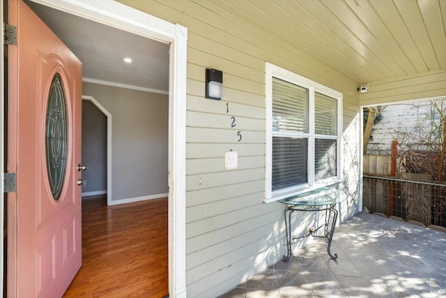 entrance to property featuring a porch