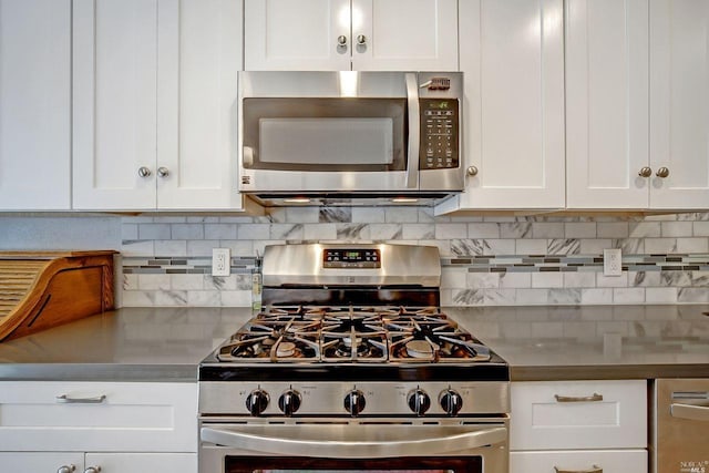 kitchen with decorative backsplash, white cabinetry, and stainless steel appliances