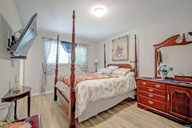 bedroom with light hardwood / wood-style flooring