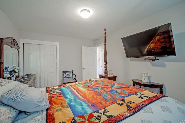 bedroom with a closet and a textured ceiling