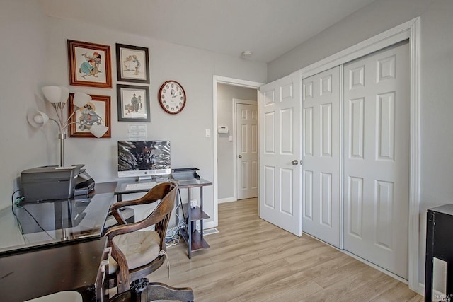 office with light hardwood / wood-style flooring