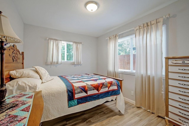 bedroom with light hardwood / wood-style flooring