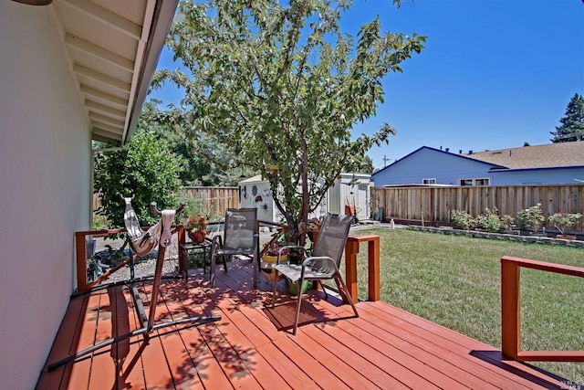 wooden deck featuring a yard