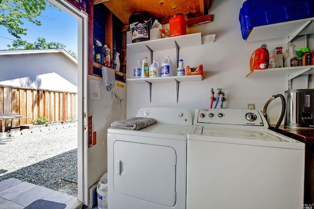 washroom featuring washer and clothes dryer