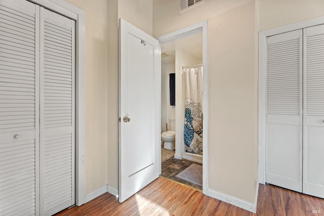 interior space with dark hardwood / wood-style floors