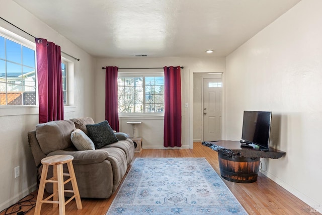 living room with light hardwood / wood-style flooring