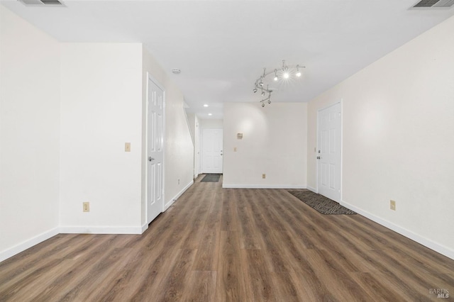 spare room featuring dark hardwood / wood-style flooring