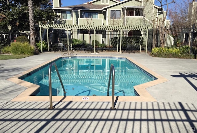 view of pool with a patio area and a pergola