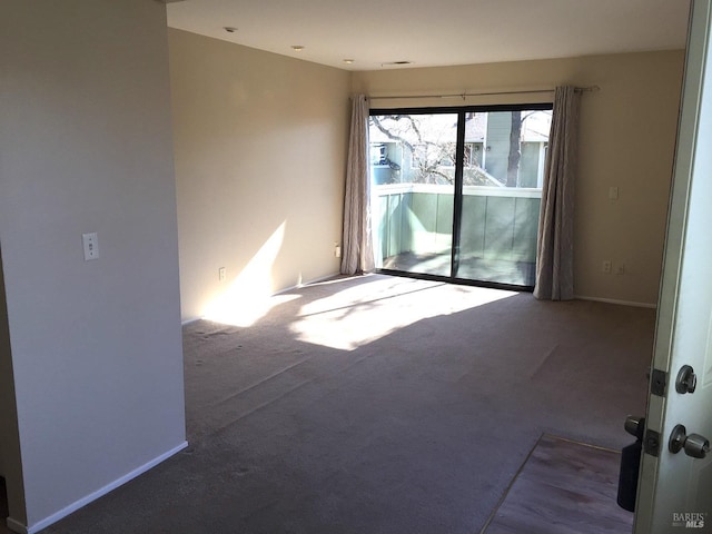 unfurnished room featuring carpet flooring