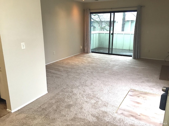 unfurnished room featuring carpet floors