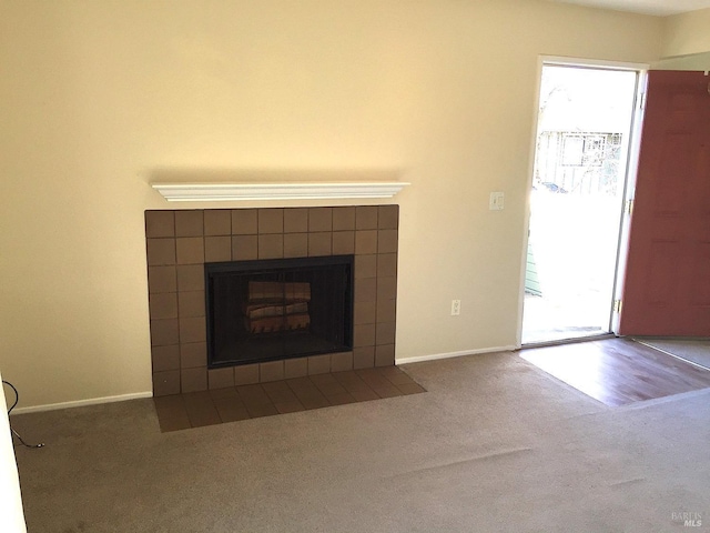 interior details with a fireplace and carpet floors