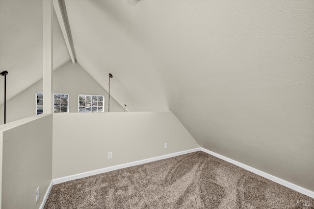 interior space with lofted ceiling and carpet