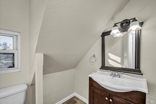 bonus room with vaulted ceiling with beams, ceiling fan, and dark colored carpet