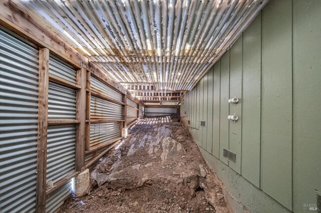 interior space featuring wood walls