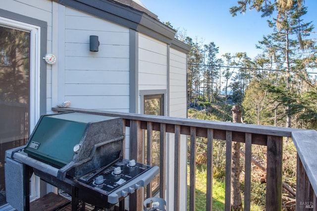 wooden terrace with a grill