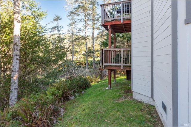 view of yard featuring a wooden deck